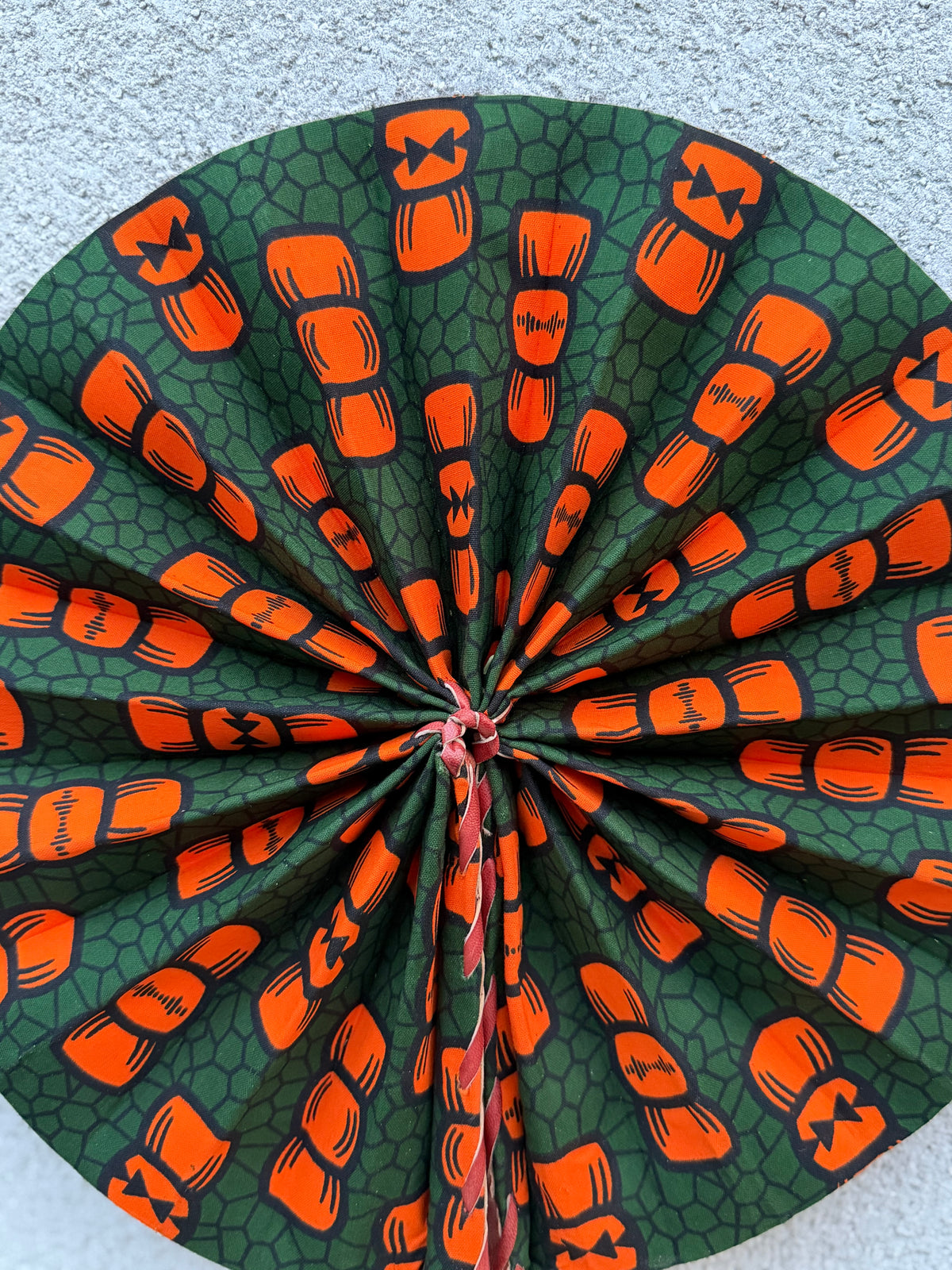 Éventail pliable wax vert & orange – Graphique