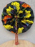 Éventail africain en wax noir jaune et orange – Éventail pliable